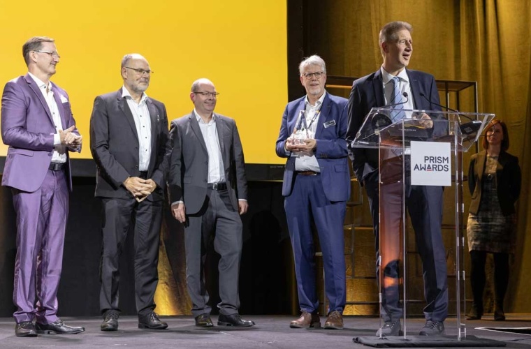 Mark Tolbert (CEO, TOPTICA Photonics, Inc.), Dr. Thomas Renner (President & CSO), Dr. Stephan Ritter (Senior Director Quantum Technology Solutions), Dr. Wilhelm Kaenders (President, Founder & CTO), and Dr. Jürgen Stuhler (VP Quantum Technologies, speaking). 📸 Credit: SPIE and Joey Cobbs