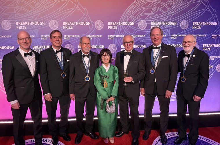 At the Breakthrough Prize ceremony on April 18, 2026, left to right: Brookhaven National Laboratory Interim Director John Hill, Fermi National Accelerator Laboratory (Fermilab) physicist Chris Polly, Boston University physicist Lee Roberts, Fermilab Director Emeritus Young-Kee Kim, CERN Director General Mark Thomson, University of Washington physicist David Hertzog, and Brookhaven Lab physicist William Morse. (Courtesy of Kat Morse)