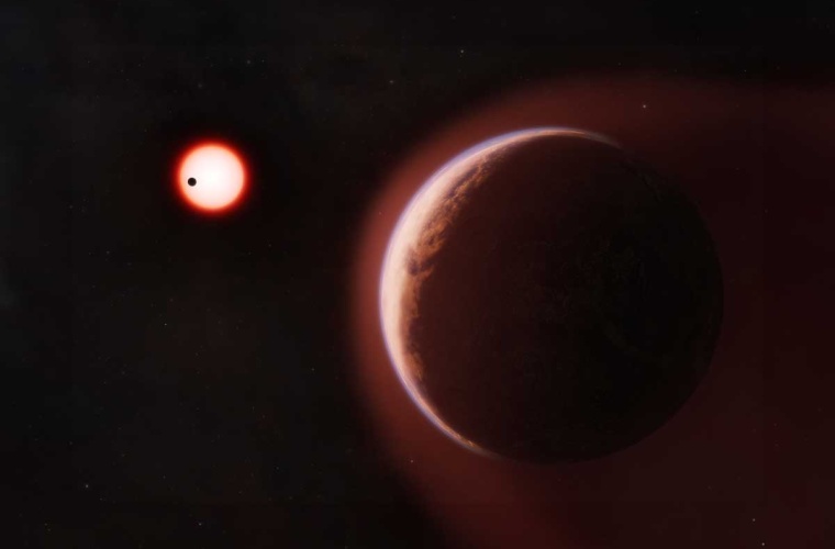 In this artist’s concept, the exoplanet LHS 1140 b is shown in the foreground, surrounded by a helium-rich atmosphere. Another nearby rocky planet orbits the same cool red dwarf star in the distance.