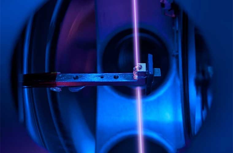 The thorium crystal and the laser beam